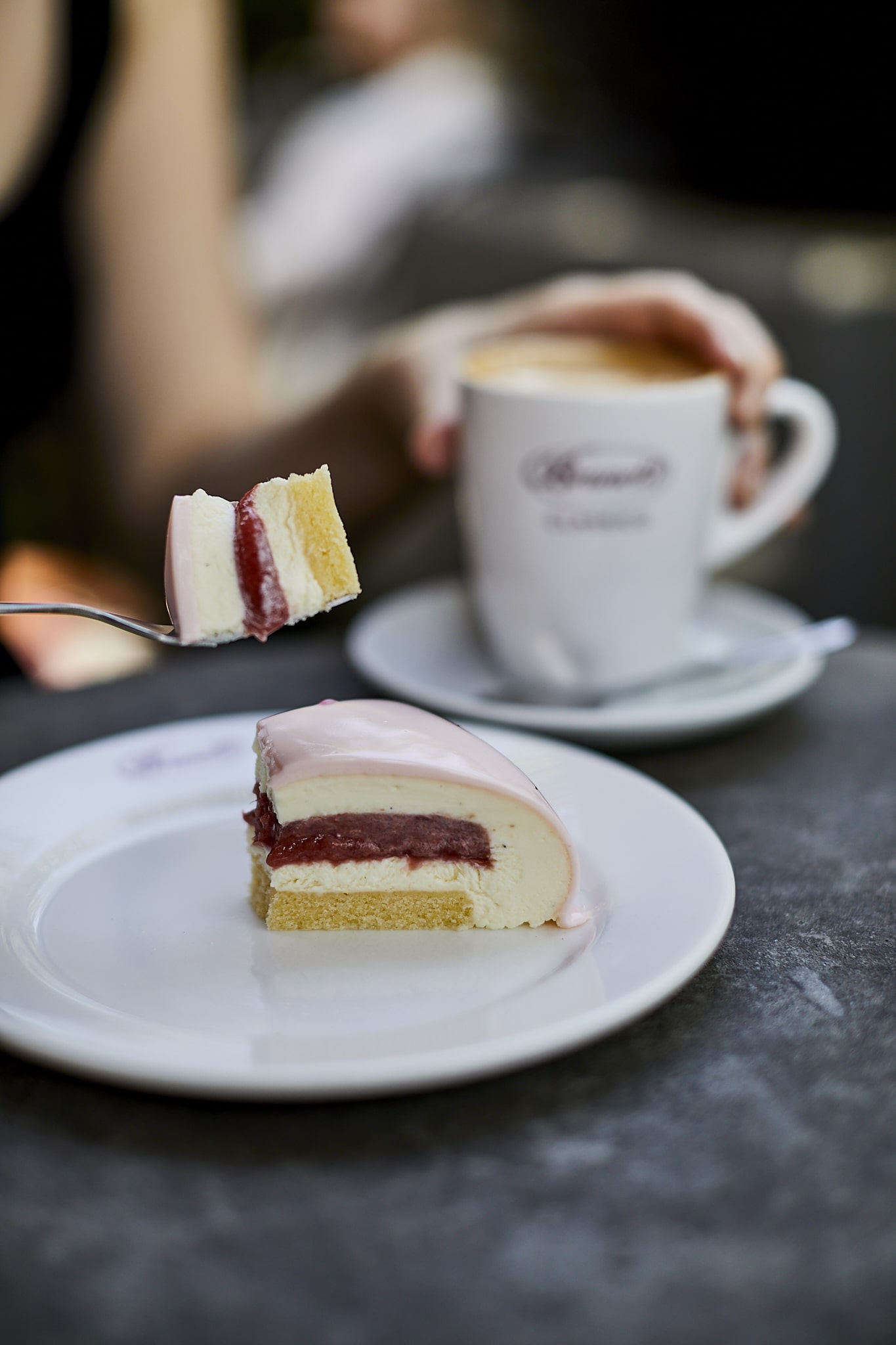 Customer enjoying slice of Fleur cake